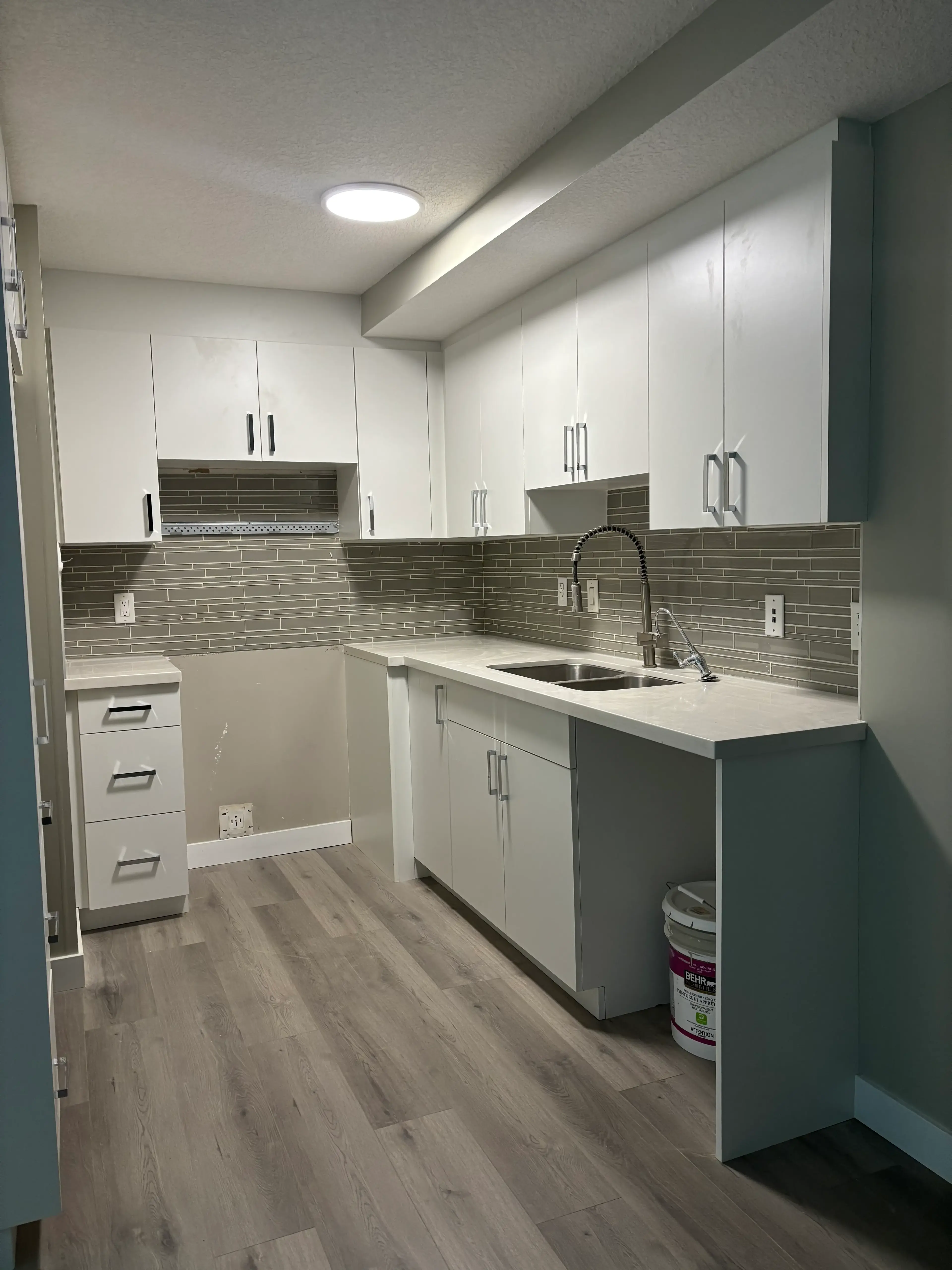 Two-Tone Kitchen with Gray Island - Calgary trade millwork project by Rocky Mountain Millwork